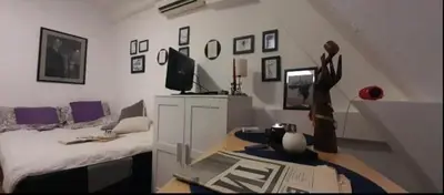 a living room with a bed and a couch at Srce Beograda in Belgrade