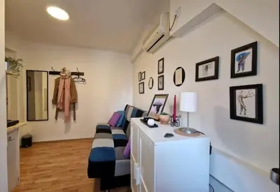 a living room with a couch and a table at Srce Beograda in Belgrade