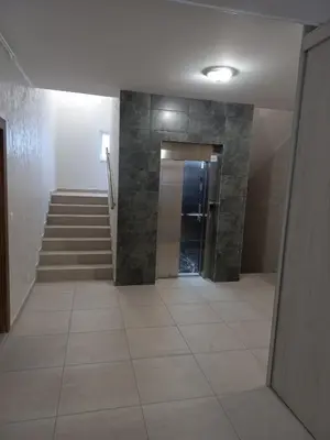 a hallway with a staircase and a stair case at Apartman Arija in Ruma