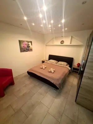 a bedroom with a bed with two towels on it at Fantastic Belgrade Nights in Belgrade