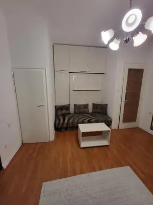a living room with a couch and a coffee table at Kod Vuka in Belgrade