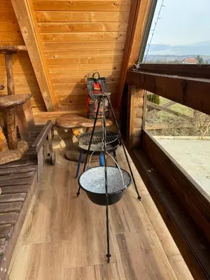 a room with a ladder in a cabin with a window at Vikendica sa bazenom u blizini Beograda in Veliki Borak