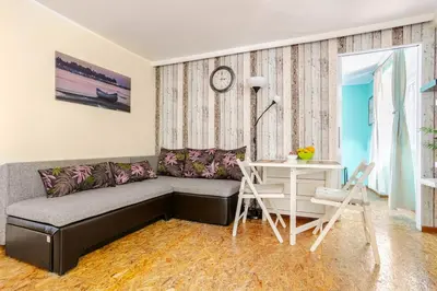 a living room with a couch and a table at White Bear 1663 Zemun Oldest House Apartment in Zemun