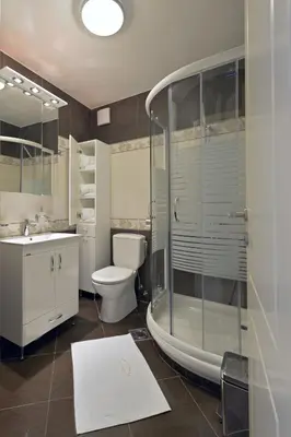 a bathroom with a shower and a toilet and a sink at Apartments Jevtic in Belgrade