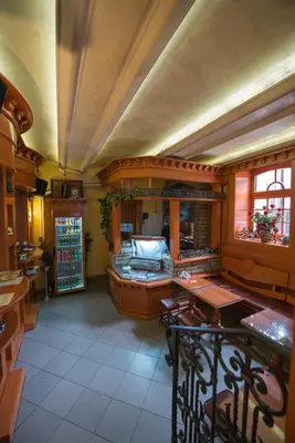 a kitchen with a table and chairs in a room at Apartments Jevtic in Belgrade