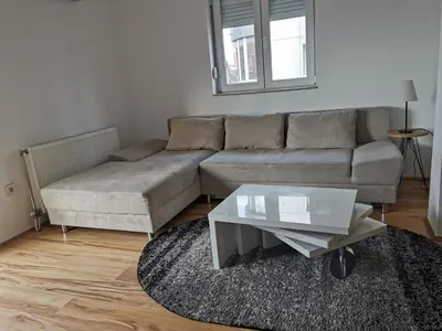 a living room with a couch and a coffee table at LoLa5 in Novi Grad