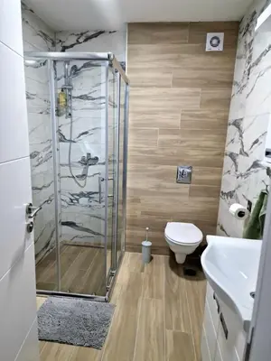 a bathroom with a shower and a toilet at lux two in Nova Pazova