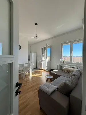 a living room with a couch and a table at Apartman Mandić in Belgrade