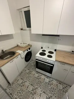 a kitchen with a stove and a sink at Apartman Mandić in Belgrade