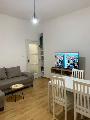 a living room with a couch and a table at Apartman Mandić in Belgrade