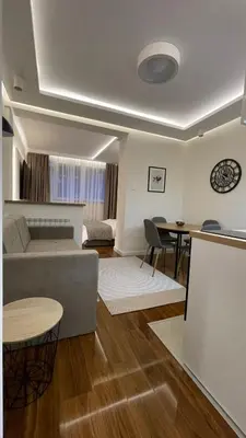 a living room with a couch and a table at Luka Luxury Suite in Belgrade