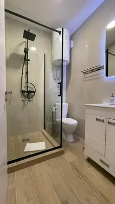 a bathroom with a glass shower and a toilet at Luka Luxury Suite in Belgrade