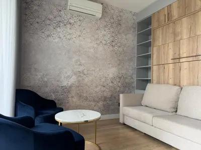 a living room with a couch and a table at BW Lux Apartments in Sajmište