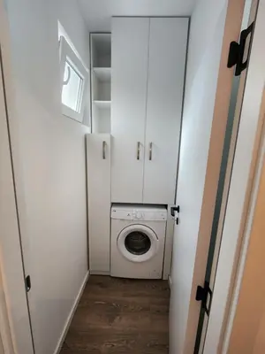 a small bathroom with a washing machine in it at Modern Cozy Suite - Vracar in Vračar (historical)