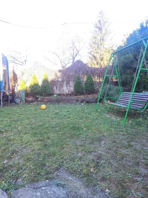 a swing set sitting in a yard with a yard at Olimp Zvezdara in Mirijevo