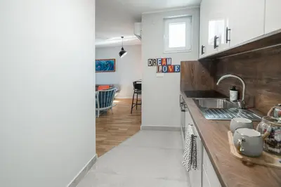a kitchen with a sink and a counter top at Apartment Nar in Karaburma