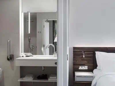 a bathroom with a sink and a mirror at Radisson Collection Hotel, Old Mill Belgrade in Belgrade