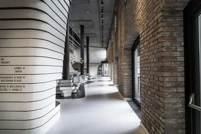 a hallway of a building with a brick wall at Radisson Collection Hotel, Old Mill Belgrade in Belgrade