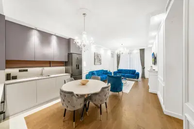 a kitchen and dining room with a table and chairs at BW Royal Dream in Belgrade