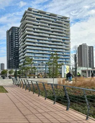a large tall building with a person sitting in front of it at BW Royal Dream in Belgrade