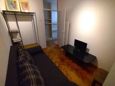 a living room with a couch and a television at ParkWest Arena Belgrade Lux Apartment in Belgrade