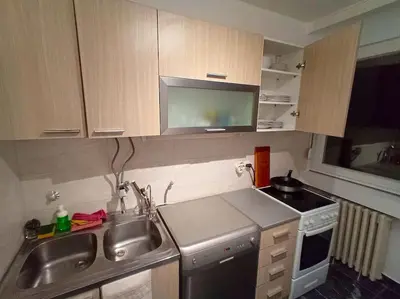a small kitchen with a sink and a stove at ParkWest Arena Belgrade Lux Apartment in Belgrade