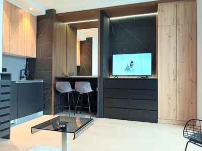 a living room with a tv and a table at Beograd na vodi - BW City View in Sajmište