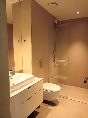 a bathroom with a shower and a toilet and a sink at Beograd na vodi - BW City View in Sajmište