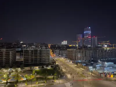 a night view of a city with tall buildings at Exceptional Belgrade Waterfront Apartment - Beograd na Vodi in Belgrade