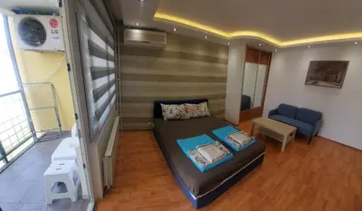 a small room with a bed and a couch at Blok 2 in Belgrade