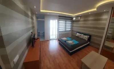 a living room with a couch and a window at Blok 2 in Belgrade