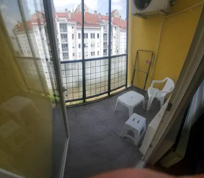 a view of a room with a window and a white chair at Blok 2 in Belgrade