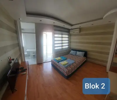 a small bedroom with a bed in a room at Blok 2 in Belgrade