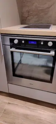 a microwave oven with its door open in a kitchen at Apartman Oki in Belgrade