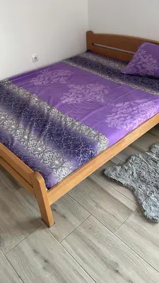 a bed with a purple mattress on the floor at Stan 3 UB in Ub