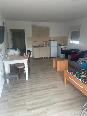a living room with a couch and a table at Stan 3 UB in Ub