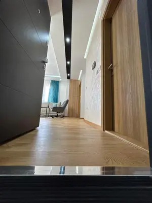 an office corridor with a door and a chair at Perla Lux 2 Apartments in Arandjelovac