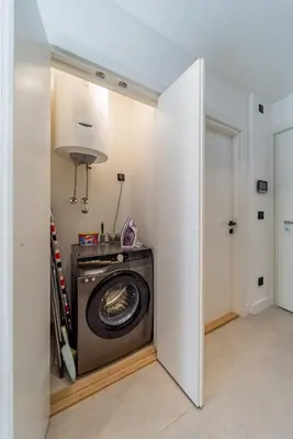 a laundry room with a washer and dryer at Chic Studio on the Belgrade's Waterfront in Belgrade