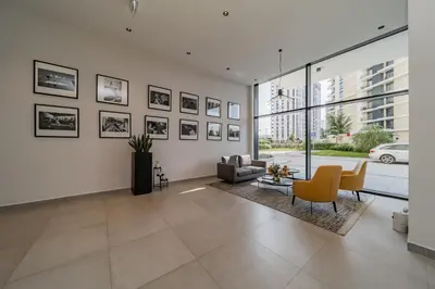 a living room with a couch and a chair at Chic Studio on the Belgrade's Waterfront in Belgrade