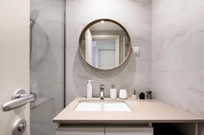 a bathroom with a sink and a mirror at inJoy in Sajmište