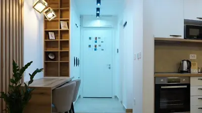 a hallway with a white door in a kitchen at Garden Oasis in Belgrade