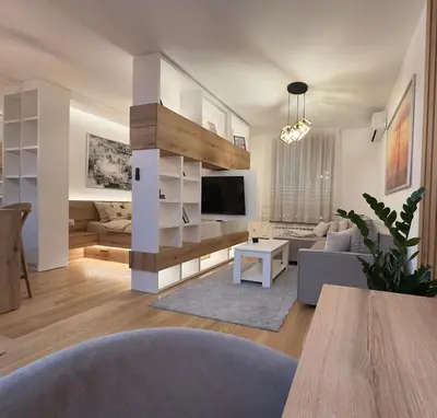 a living room with a couch and a tv at Garden Oasis in Belgrade