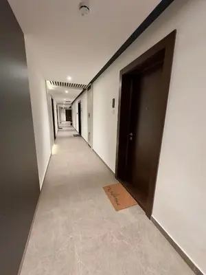 an empty corridor with a door and a tile floor at Garden Oasis in Belgrade