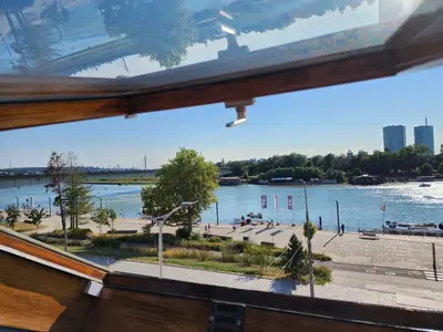 a view of a river from a window at Earth & Sky apartment in Sajmište