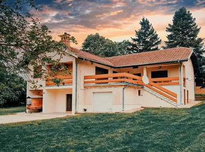 a house with a garage in the yard at Vila Avala in Belgrade