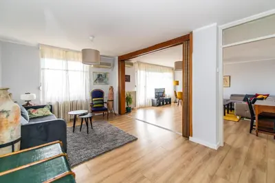 a living room and dining room with a mirror at 7 Heaven in Belgrade