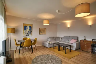 a living room with a couch and a table at 7 Heaven in Belgrade