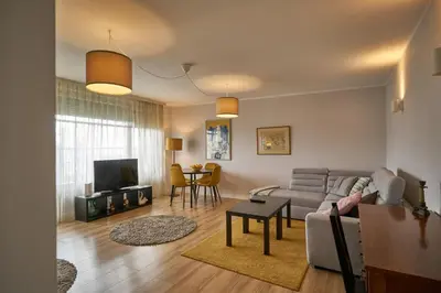 a living room with a couch and a table at 7 Heaven in Belgrade