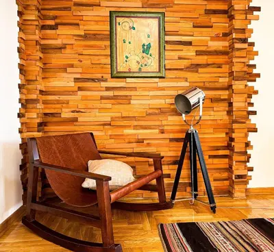 a room with a wooden wall with a chair and a camera at Friends Loft with Terrace & River View Old Town in Belgrade