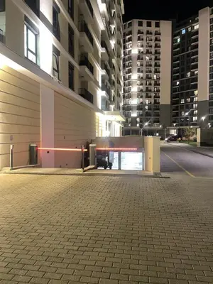 an empty parking lot in a city at night at BW Elena in Belgrade